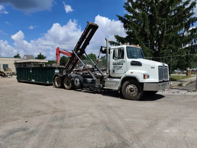 Roll Off dumpster rental truck for construction site